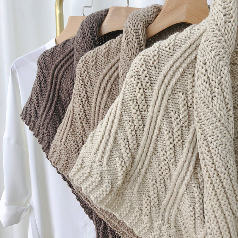 Knitted triangle shawl with leather buckle